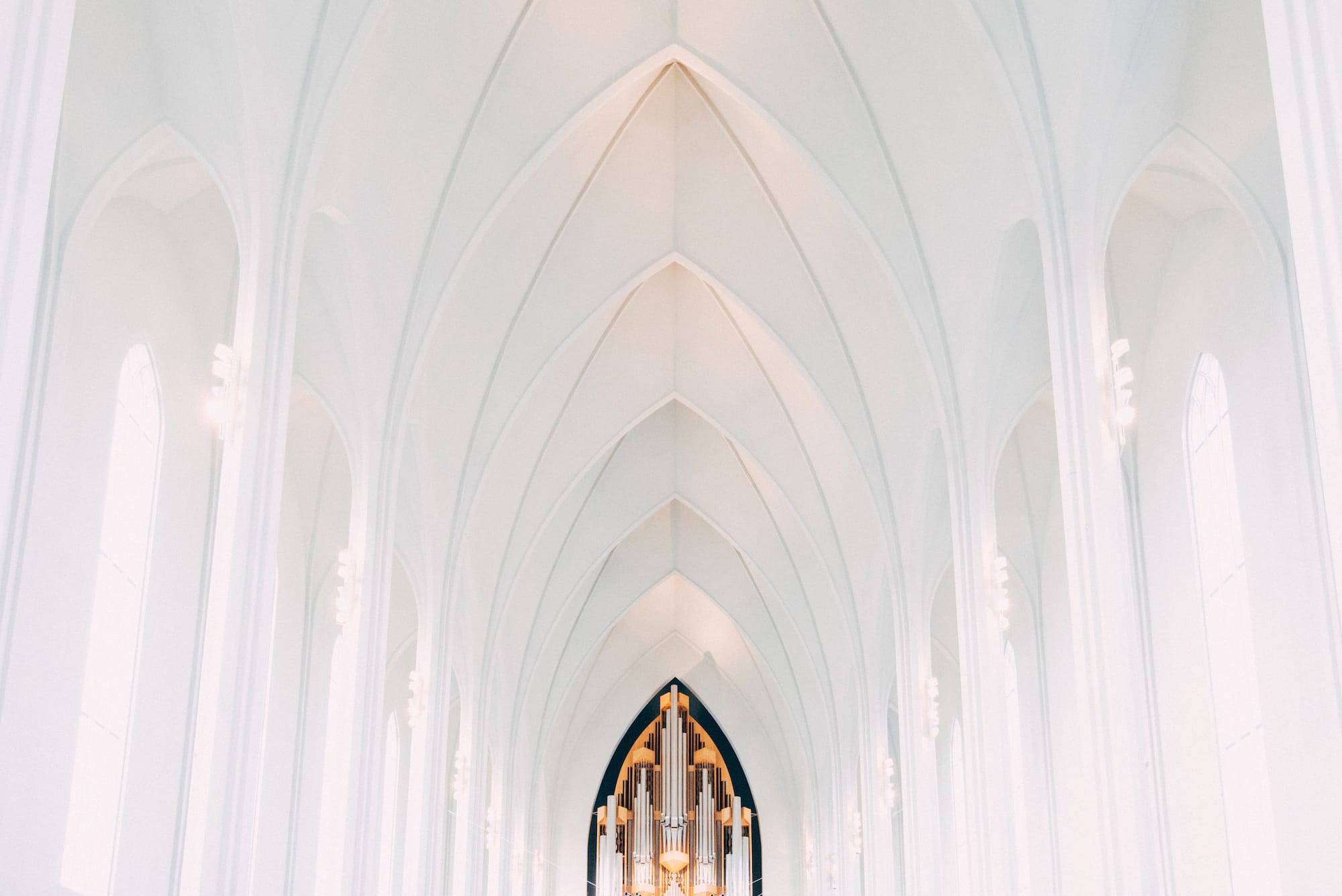 Interior of the Hallgrímskirkja church showing just the cieling. At the end is an organ.