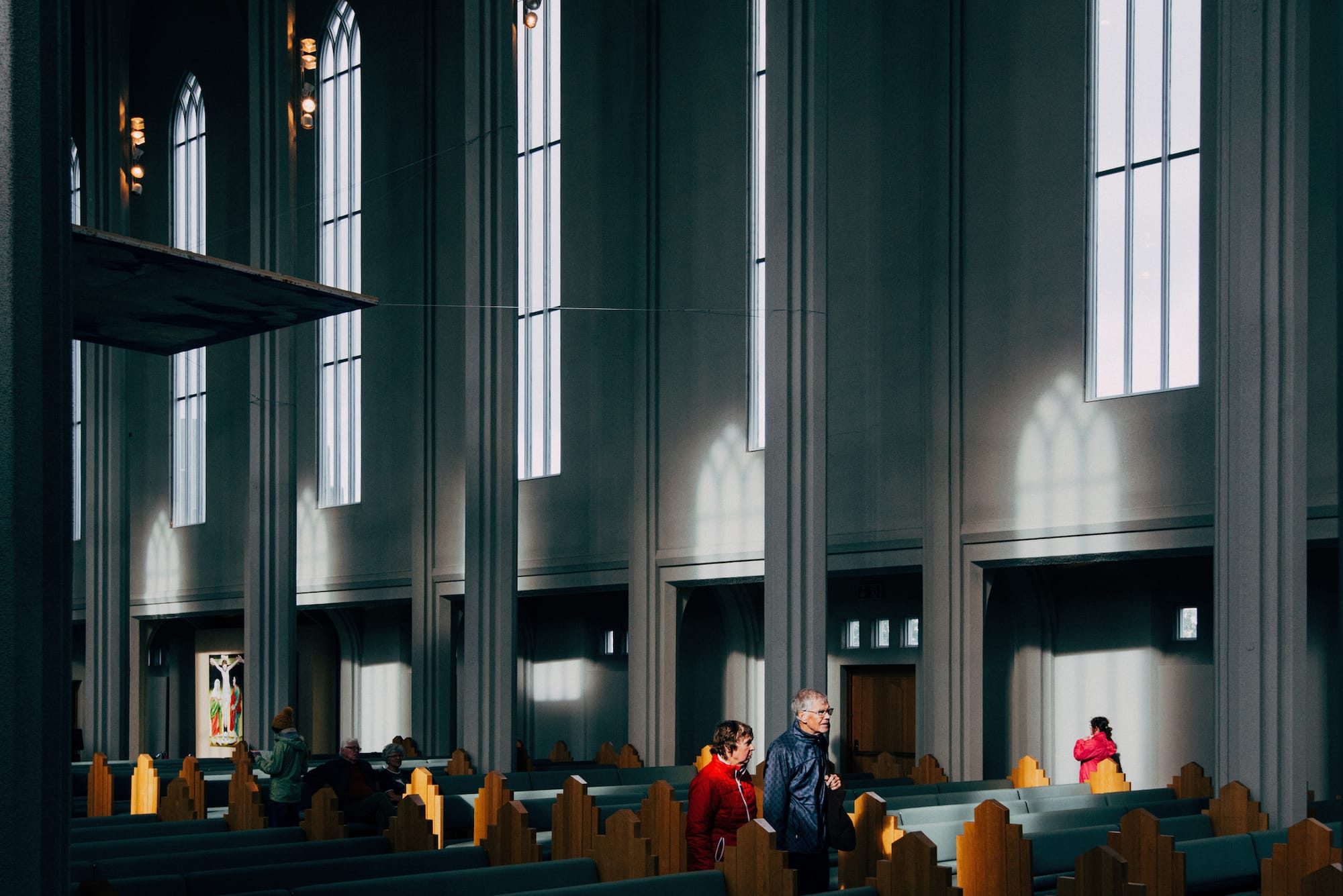 As people leave the Hallgrímskirkja they pass through sunlight streaming in from the windows.