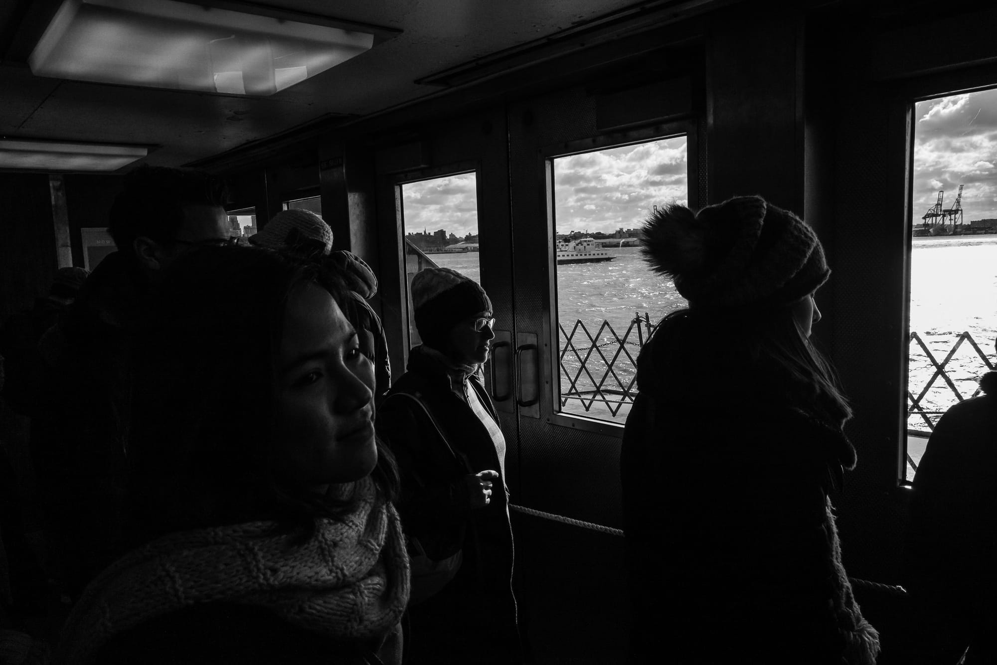 Women on the Staten Island ferry enjoy the view.