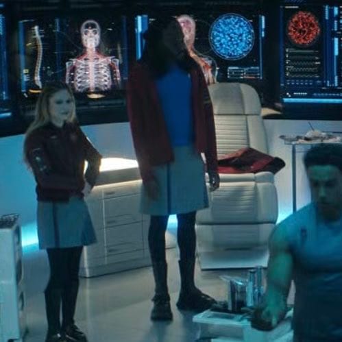 A male Klingon in a skirt in a medical bay.