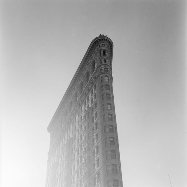 The top half of the Flatiron Building in NYC.