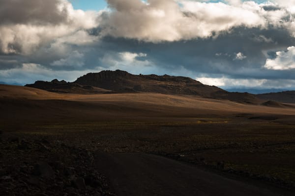 A jagged rocky hill in the distance stands out from the landscape.