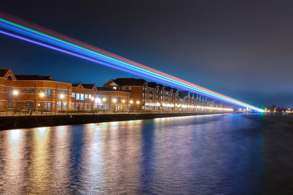 Rainbow beams of light shine across the nights sky.