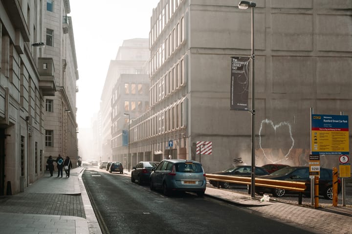 Buildings fade to nothing in the foggy morning light in Liverpool.