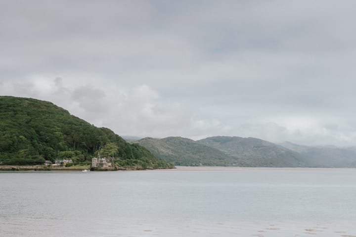 An overcast day at Barmouth Estuary. Hills lead off into the distance.