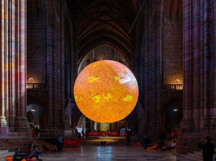 Helios, a touring artwork by Luke Jerram, is installed inside Liverpool Cathedral.