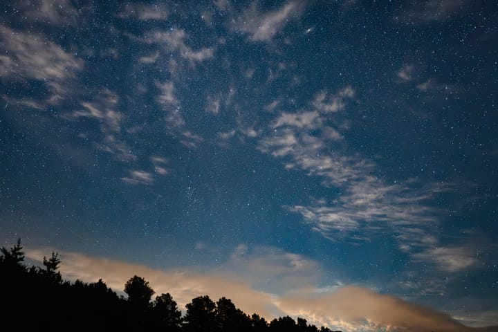 Night sky with stars and clouds