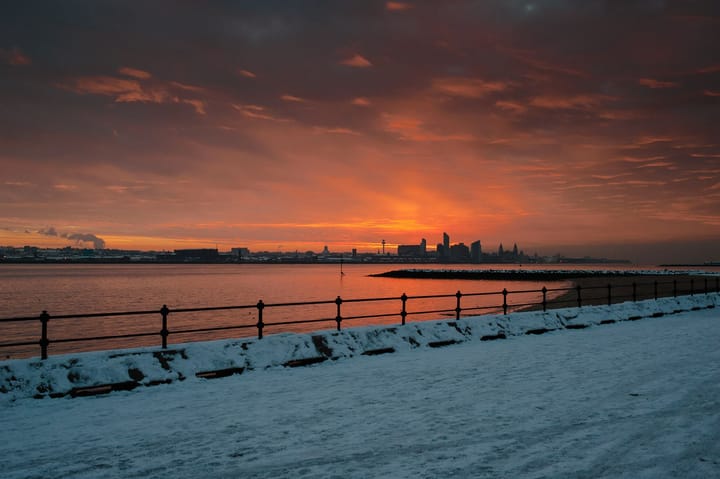 Sunrise from New Brighton Promenade on a snowy day.