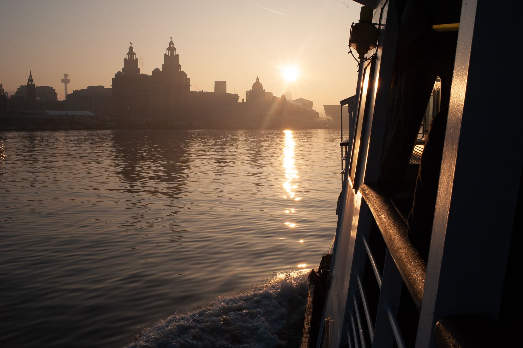 Sunrise as the Mersey Ferry heads towards Liverpool.