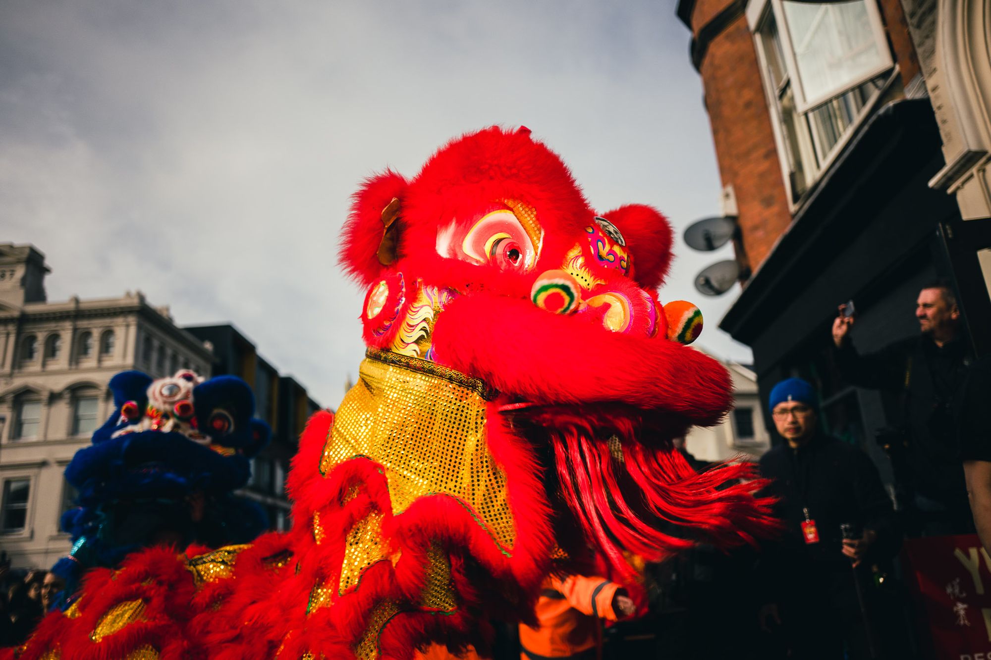 A bold red dragon dances outside a resturant at Chinese New Year.