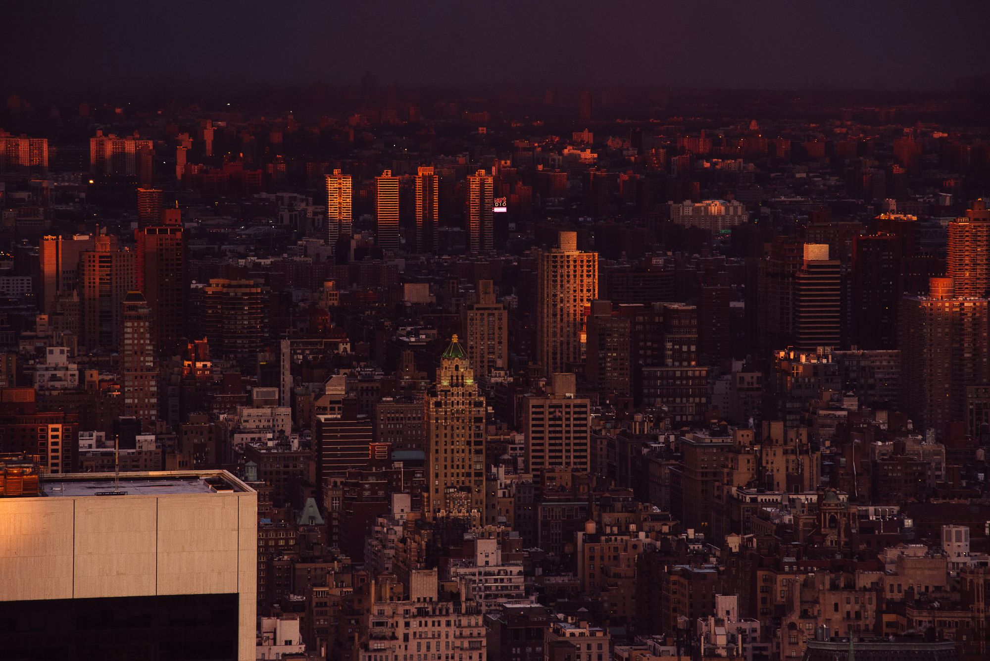 A view up Manhattan of apartment blocks at sunset.